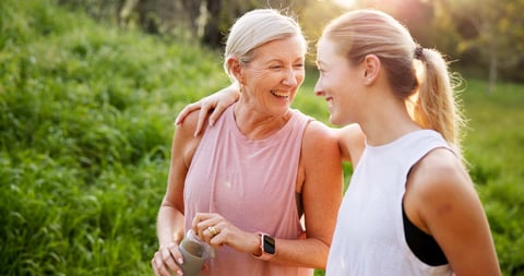 Mature woman, daughter and outdoor on walk for fitness, wellness and exercise in nature with laughing